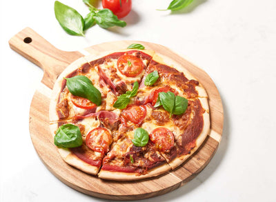 Proscuitto and basil pizza